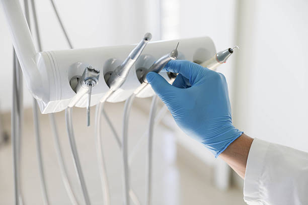 Professional Tooth Extraction technician working in Ann Arbor, MI